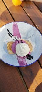 a purple dessert on a plate on a table at Apartmán Horalka 7 v Peci pod Sněžkou in Pec pod Sněžkou