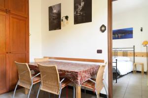 a dining room with a table and chairs at Fattore 8 in Levanto