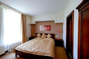 Postel nebo postele na pokoji v ubytování Campus Hotel
