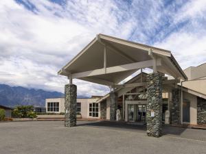 a large building with a large awning on it at Mercure Queenstown Resort in Queenstown