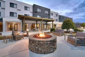 a fire pit in a courtyard in front of a building at Courtyard by Marriott Johnson City in Johnson City