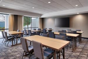 a conference room with tables and chairs and a screen at Courtyard by Marriott Johnson City in Johnson City +31 photos