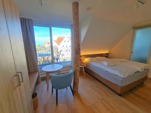 Postel nebo postele na pokoji v ubytování Gästehaus Seeblick