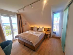 Postel nebo postele na pokoji v ubytování Gästehaus Seeblick