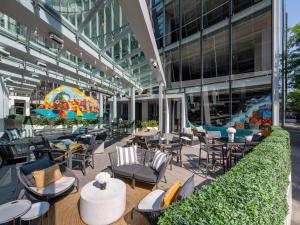 an outdoor patio with tables and chairs in a building at Sofitel Chicago Magnificent Mile in Chicago