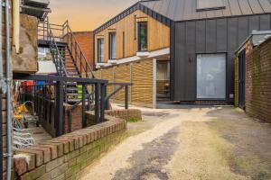 a house being constructed with a brick wall at Super Central 3 bed in Richmond in Richmond