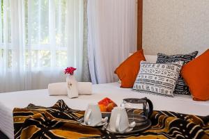 Ένα ή περισσότερα κρεβάτια σε δωμάτιο στο SWAHILI BEACH APARTMENTS +73 φωτογραφίες