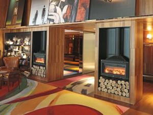 a lobby with a fireplace in a room at Dunhua Mansion Taipei - MGallery Collection in Taipei