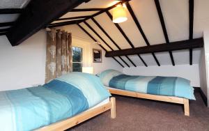 Postel nebo postele na pokoji v ubytování Sparrows Nest Holiday Cottage