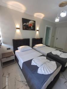 Postel nebo postele na pokoji v ubytování Olive House