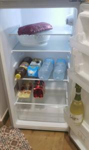 an open refrigerator filled with food and drinks at Casa vacanze - "O Tunnu" in Avola