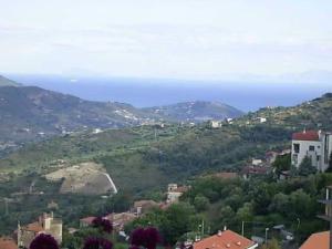 a town on a hill with the ocean in the background at Santa Barbara Guest House - Vicino Agropoli in Torchiara