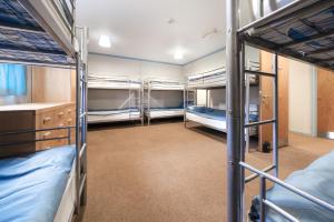 En eller flere senge i et værelse på Rural Group Lodging 19 rooms 83 beds Games room + 30 billeder