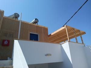 a building with two lights on top of it at Ocean Palace in Prasonisi