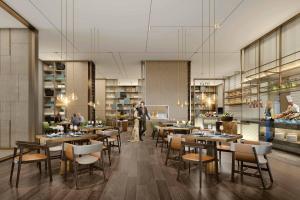Ein Restaurant oder anderes Speiselokal in der Unterkunft Surat Marriott Hotel 