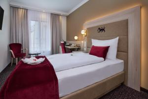 Postelja oz. postelje v sobi nastanitve Hotel St.Gotthard