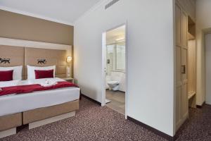 Postelja oz. postelje v sobi nastanitve Hotel St.Gotthard