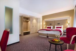 Postelja oz. postelje v sobi nastanitve Hotel St.Gotthard
