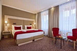 Postelja oz. postelje v sobi nastanitve Hotel St.Gotthard