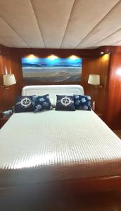 a bedroom with a large bed on a boat at Felicita in Marina di Portisco