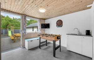 a kitchen with a chess board on a table at 4 Bedroom Lovely Home In Tarm in Tarm