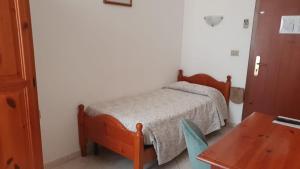 Postel nebo postele na pokoji v ubytování Hotel 4 Mori
