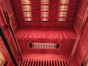 a red staircase with red walls and ceilings at Maritan Hotel & Spa in Padova