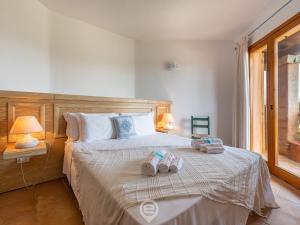 Posteľ alebo postele v izbe v ubytovaní Casa Perla