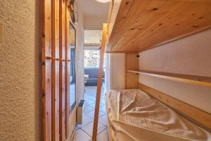 Postel nebo postele na pokoji v ubytování Studio au pied des pistes