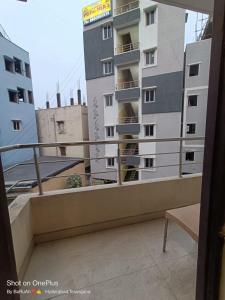 a balcony with a view of a building at WAY INN FAMILIAR in Hyderabad