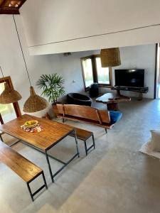 Et tv og/eller underholdning på Casa pé na areia em Caraíva