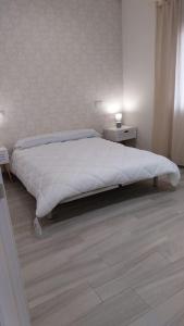 En eller flere senge i et værelse på Casa Gabritana