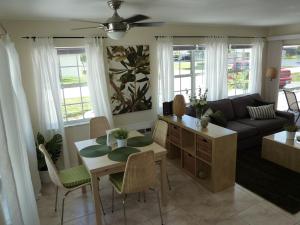 a living room with a table and a couch at Beach Resort in Cape Coral in Cape Coral