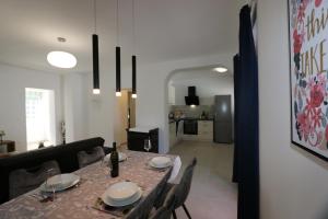a dining room with a table and chairs at Apartment Elena in Soline