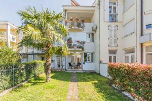 a palm tree in front of a building at Apartment in Porec/Istrien 10331 in Poreč