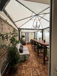 a dining room with a table and a large tent at NEW Ground Floor apt and PATIO in Florence