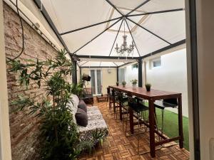 a patio with a table and chairs and an umbrella at NEW Ground Floor apt and PATIO in Florence