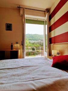 Un pat sau paturi într-o cameră la Ristorante Le Rasole