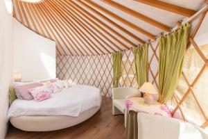 Voodi või voodid majutusasutuse L.stile Glamping toas