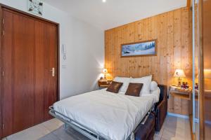 Кровать или кровати в номере Smartstay au reve Savoyard - Studio N 2