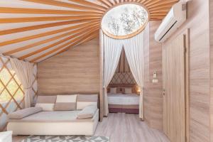 Voodi või voodid majutusasutuse L.stile Glamping toas