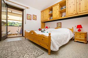 Posteľ alebo postele v izbe v ubytovaní Residence Christina Due Laghi - Happy Rentals + 18 fotografií