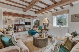 a living room filled with furniture and a fireplace at Hiron's Piece - Hot Tub Packages Available in Weston Subedge
