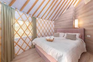 Voodi või voodid majutusasutuse L.stile Glamping toas