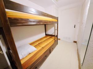a room with a bunk bed in a room with a staircase at Studio Pra-Loup, 1 pièce, 6 personnes - FR-1-165A-74 in Uvernet