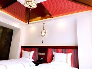 Postelja oz. postelje v sobi nastanitve Family Hotel Zhangjiajie
