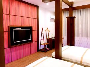 Postelja oz. postelje v sobi nastanitve Family Hotel Zhangjiajie