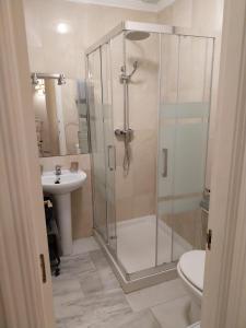 a bathroom with a shower and a toilet and a sink at Home4Holidays in Nerja