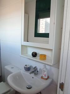 a bathroom with a sink and a mirror at Arrabassada in Tarragona