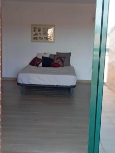 a bedroom with a bed in a room at Arrabassada in Tarragona